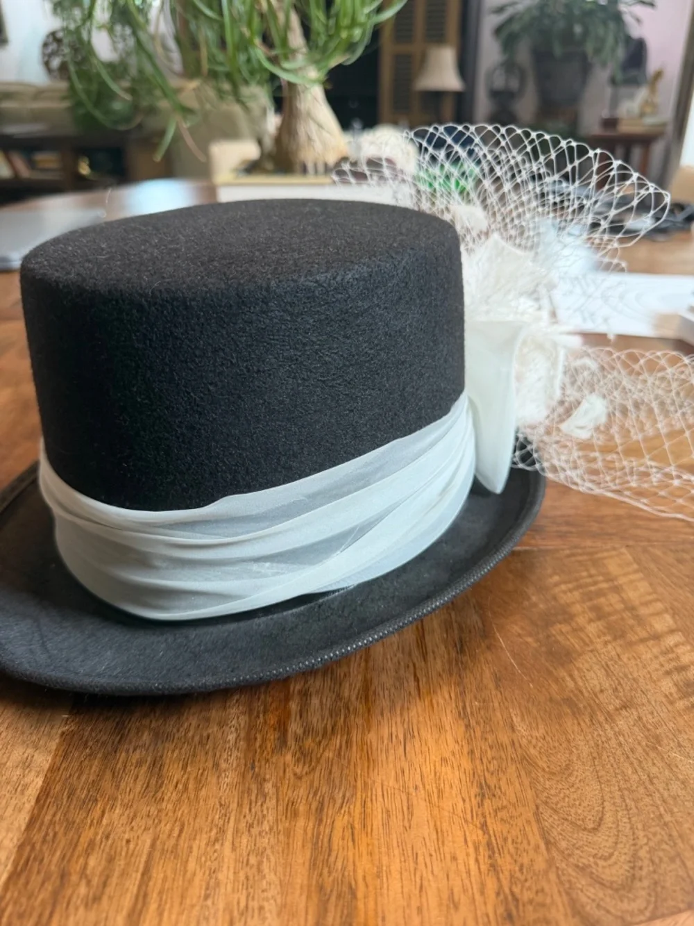 Black Felt Top Hat With White Toole Band, Silk Flowers, Feathers and Netting